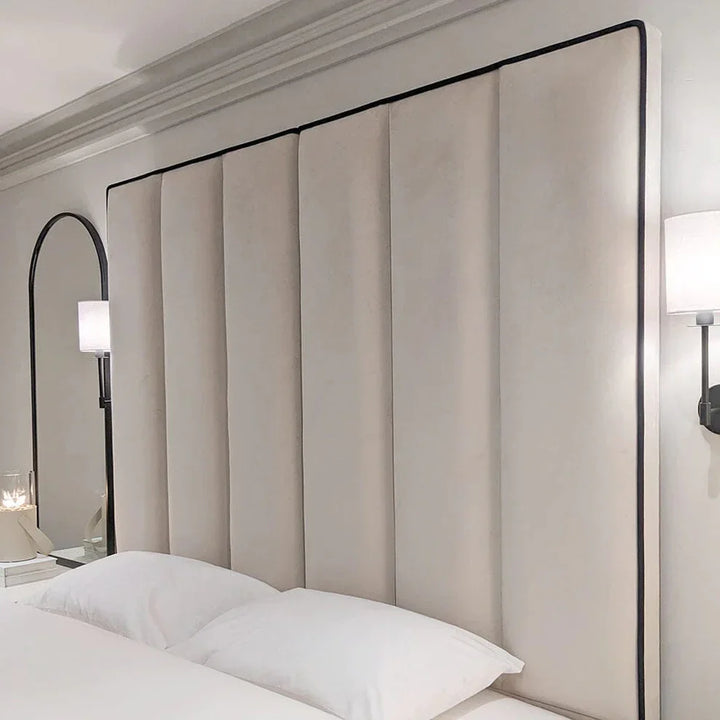 The Wenger Panel Upholstered Plush Velvet Black Piping Bed Frame