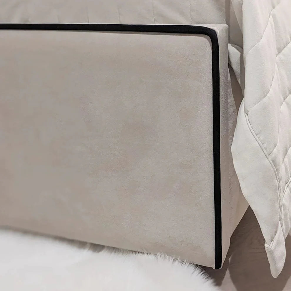 The Wenger Panel Upholstered Plush Velvet Black Piping Bed Frame